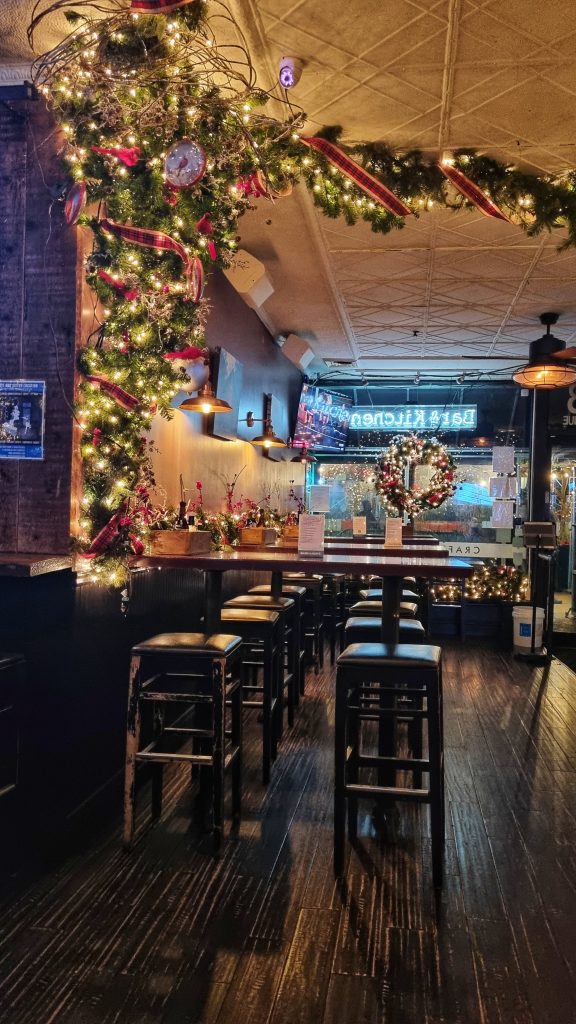 Going on a bar crawl is a great thing to do for couples in NYC. This image is taken from one of the bars we visited that was decorated for Christmas with plenty of tinsel, reefs, fairy lights and ribbon.
