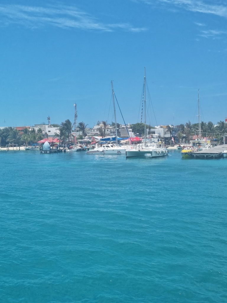 Boats on the water coming into Isla Mujeres.