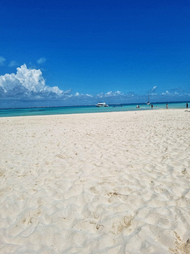 Beautiful Playa Norte beach in Isla Mujeres with the golden sandy beach and crystal blue water.