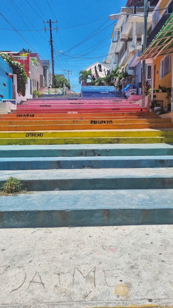 Multi-coloured steps in Isla Mujeres. This is a prime spot for people to take pretty Instagrammable spots.
