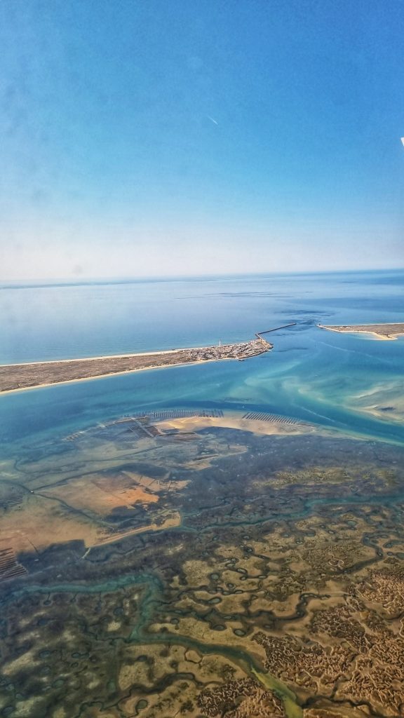 View of Faro from above which shows the beautiful blue sea and greenery it has to offer.