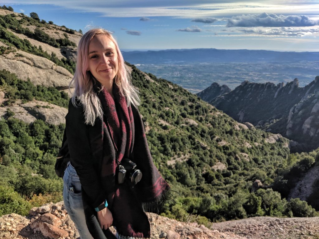 Amy posing at the top of Montserrat.