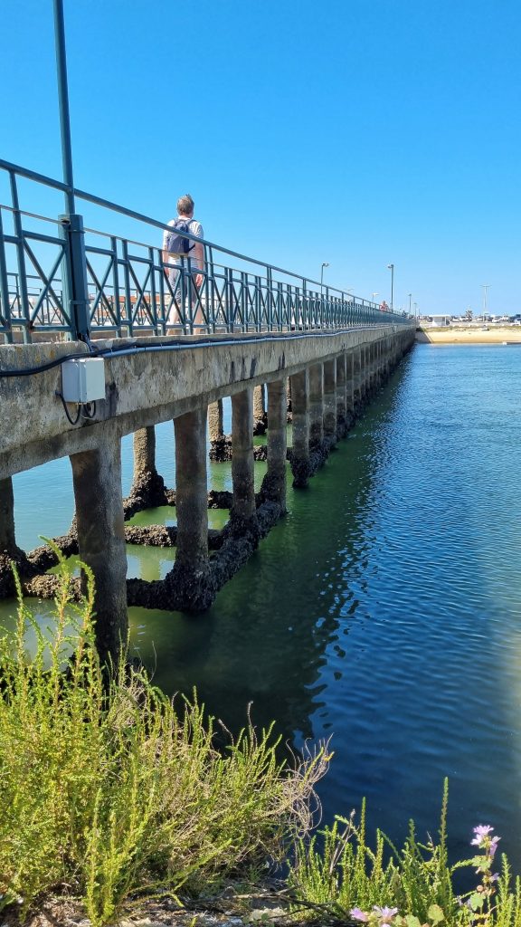 Walking across the bridge for Praia de Faro.