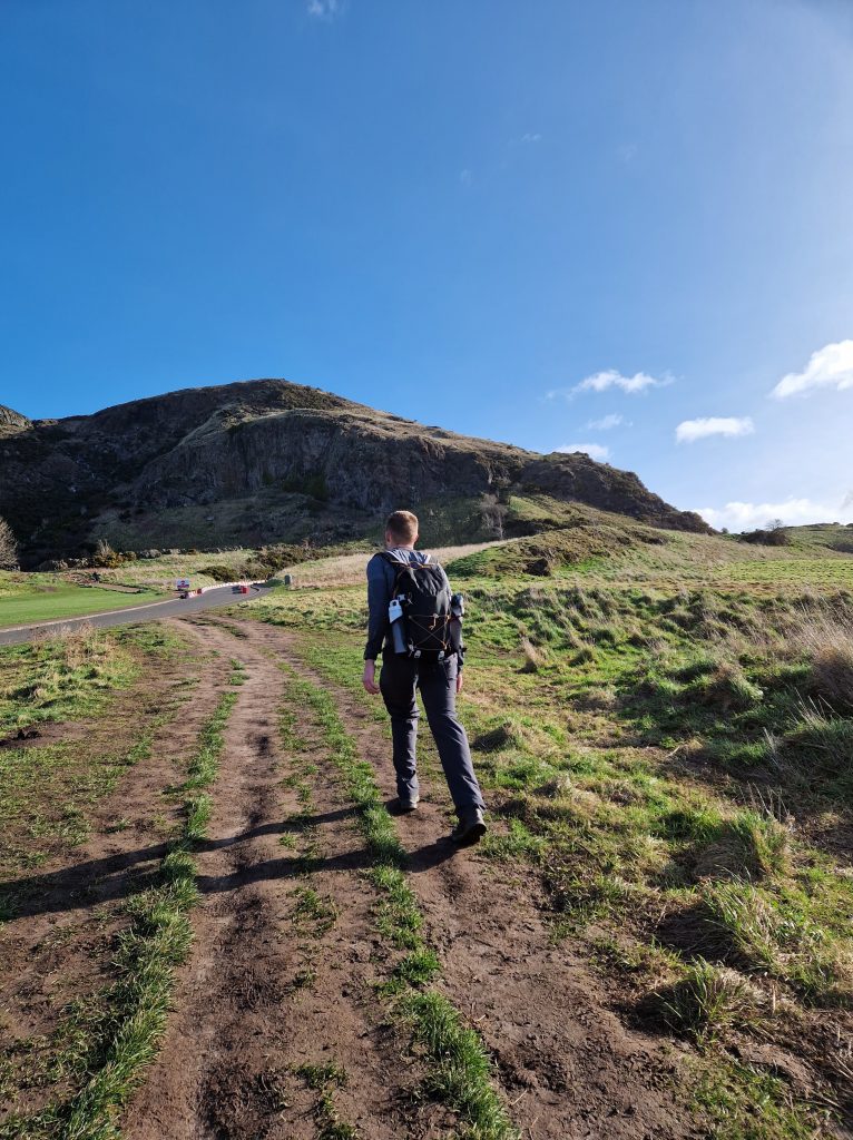 Liam walking towards the start of the Arthur's Seat route.