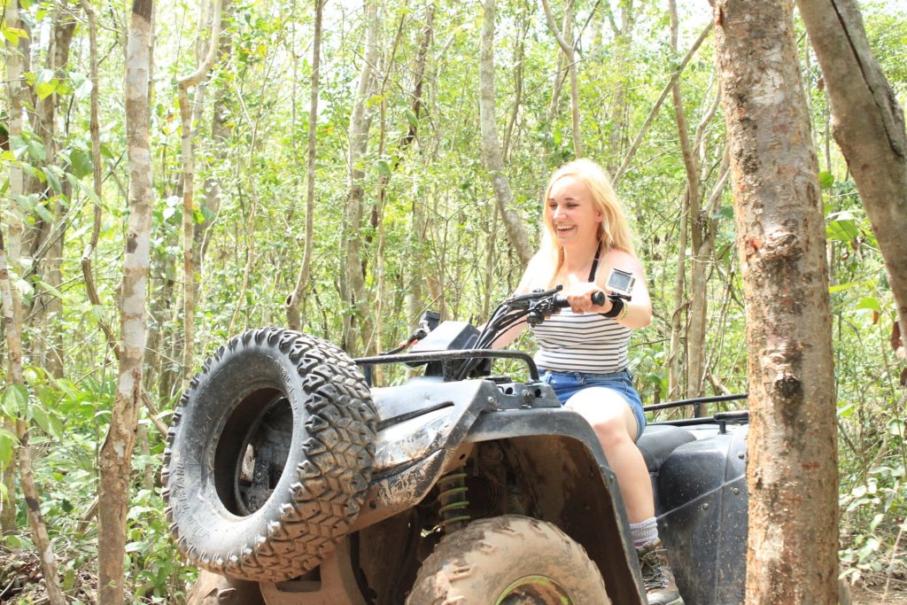 Amy enjoying her ATV experience in the Mexican jungle.
