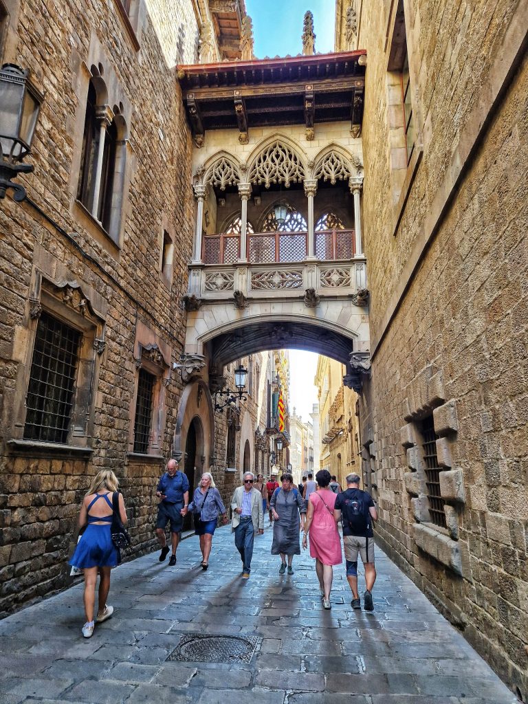 If you have limited time then going on a free walking tour of Barcelona. This image shows walking through the gothic quarter in Barcelona.