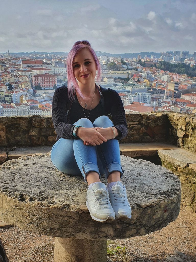 Amy with the view of Lisbon city behind from Castle de Sao Jorge.