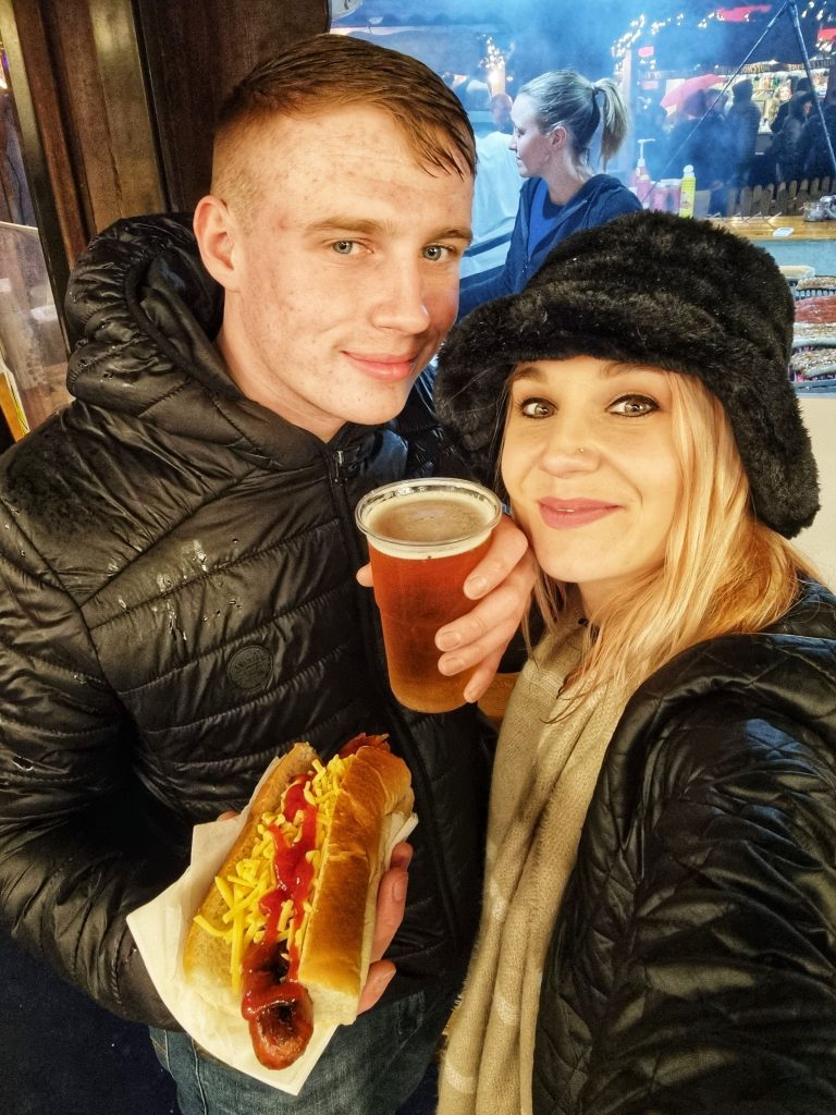 Amy & Liam enjoying a beer and a hot dog at the Christmas Markets in Edinburgh.