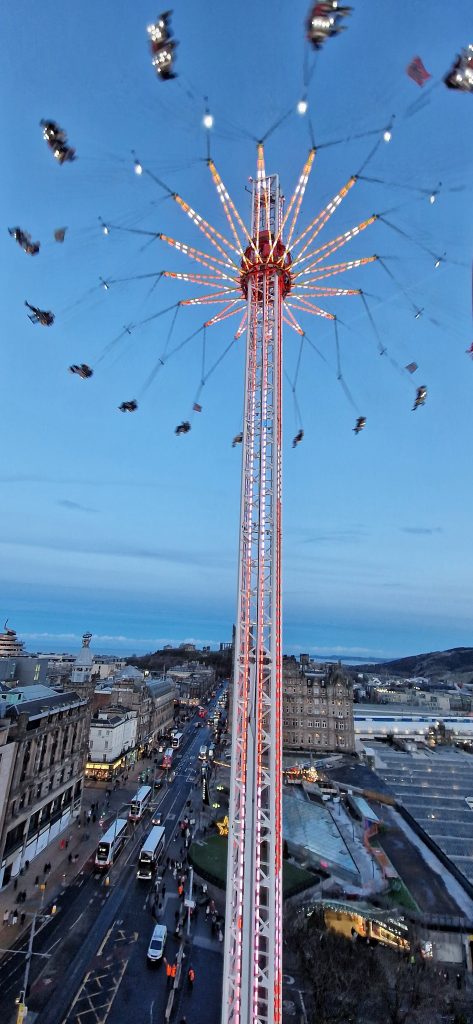 One of the large rides in Edinburgh during the Christmas markets. You sit in a swing like chair and it raises up high and spins around.