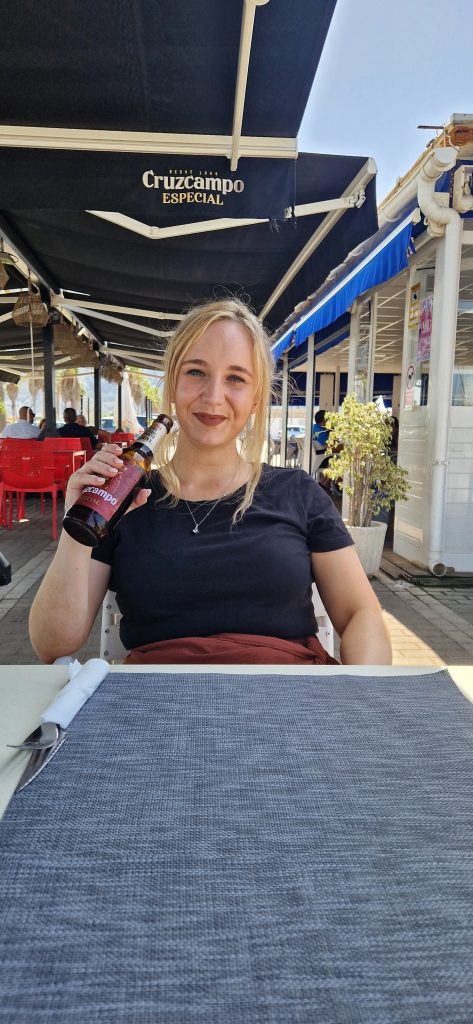 Amy enjoying a beer at the small border town La Linear de la Concepcion.