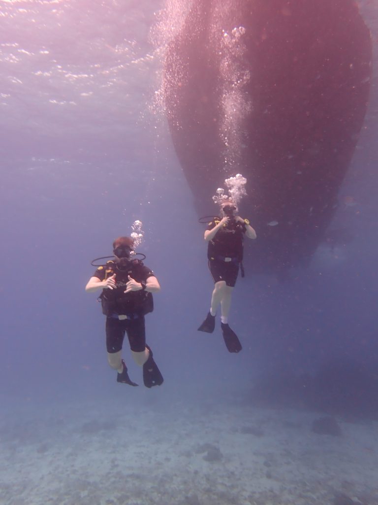 Liam & Amy beginning their dive. Amy struggles equalising so in this image she is still equalising.