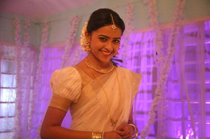 Sri Divya in white pavadai thavani