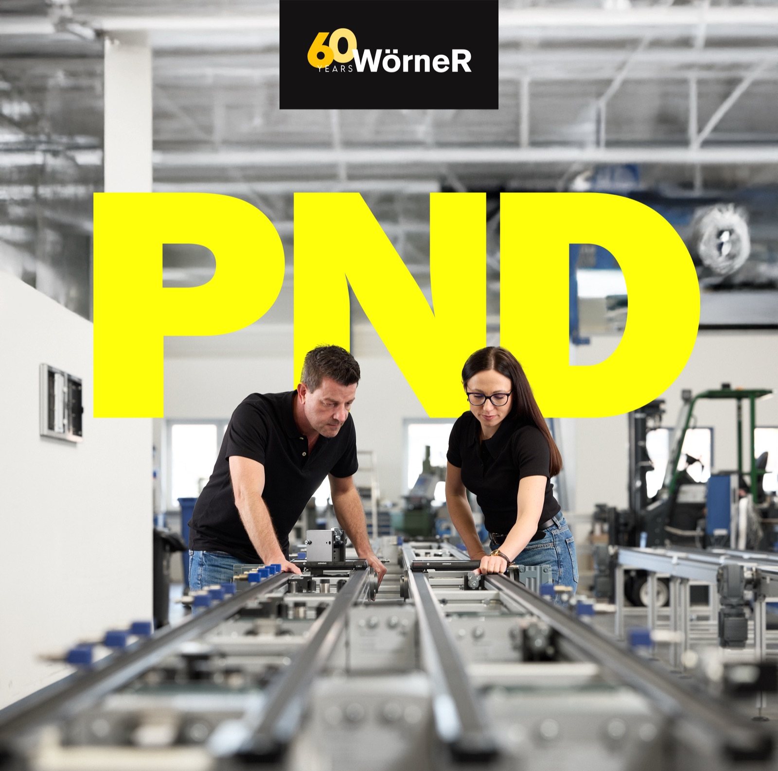 Two Woerner engineers working together on a PND Series assembly line