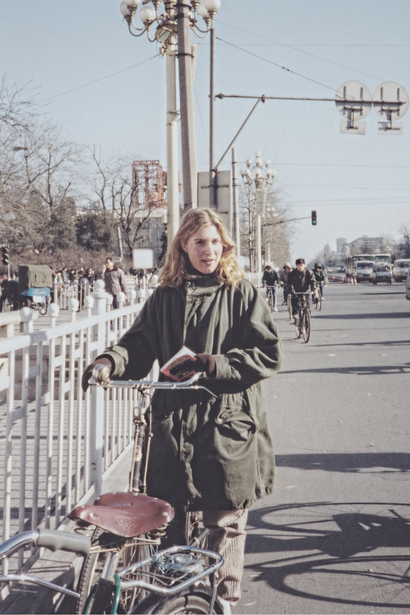 woman on a bike in beijing china