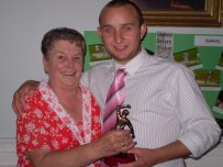 Alan receives one of his awards from Cricket Club President Lizzie Traylor