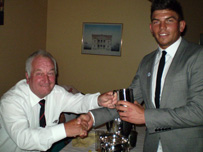 Shane receives his Supporters Player-of-the-Year Trophy from club president Idris Gwilt