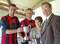 Steve Kay and Alan Stocker receive the Trophy from Ffion and Ron Sparey