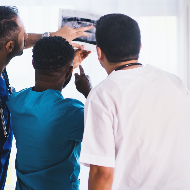 healthcare professionals looking at x ray