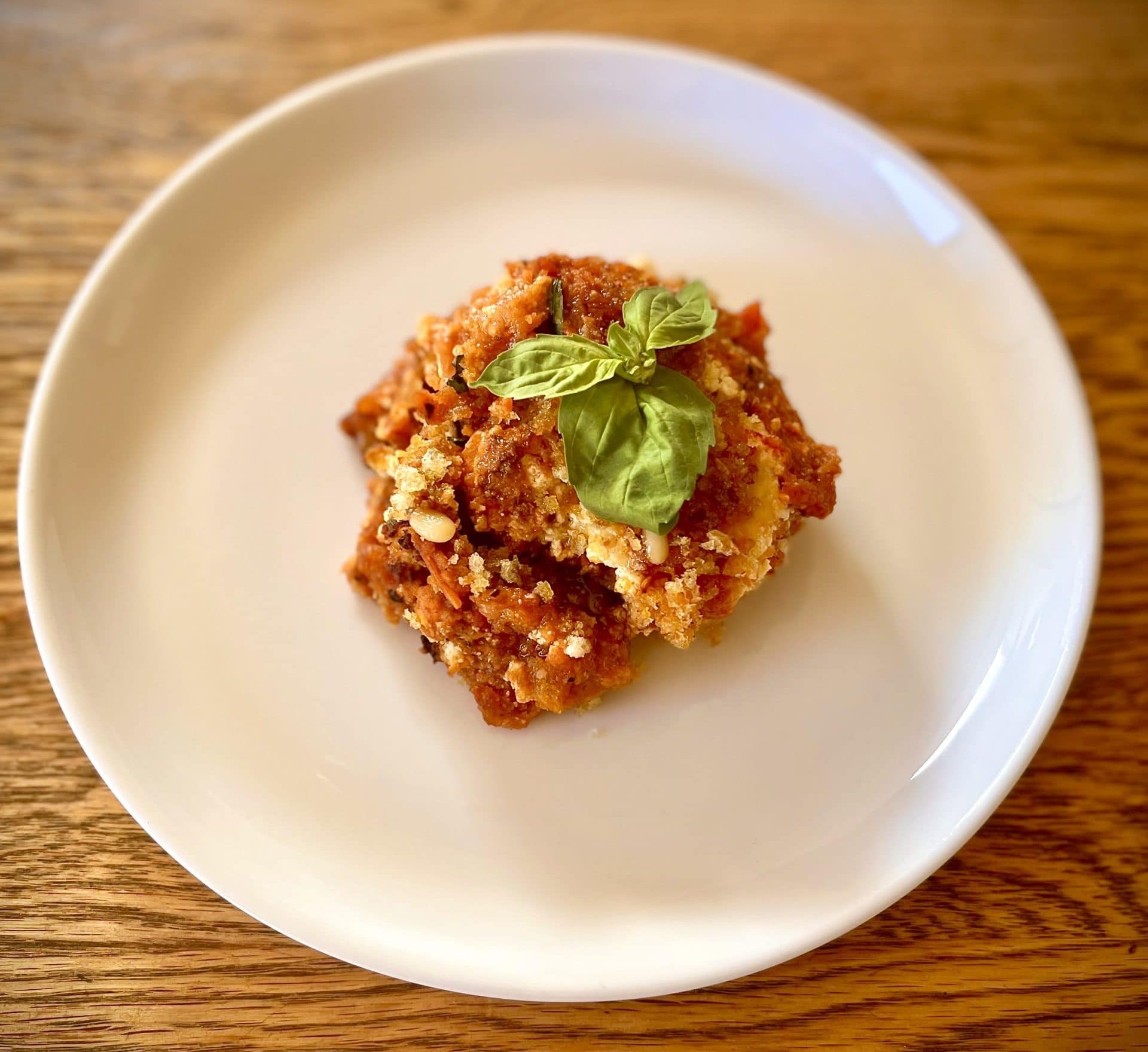 Baked ricotta and aubergine with spicy tomato sauce and pangritata 