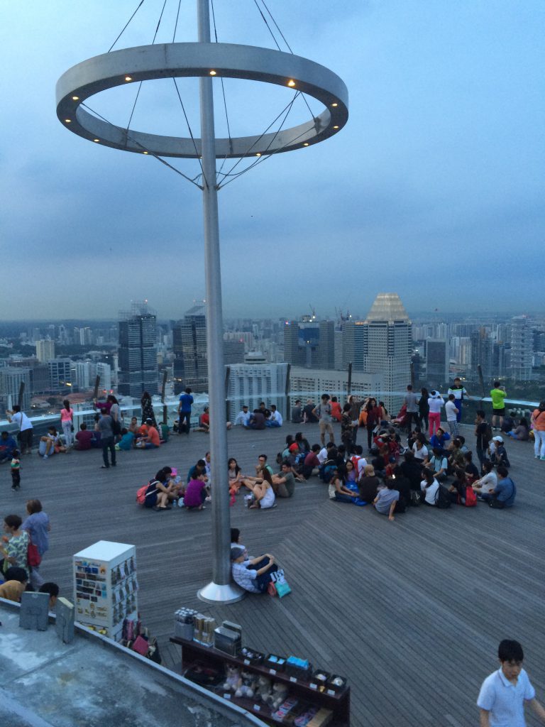 a picture of tourists sitting on a rooftop