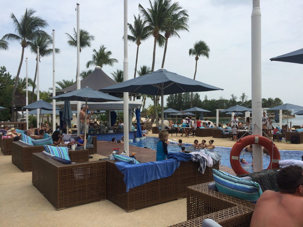 a picture of tourists at a swimming pool