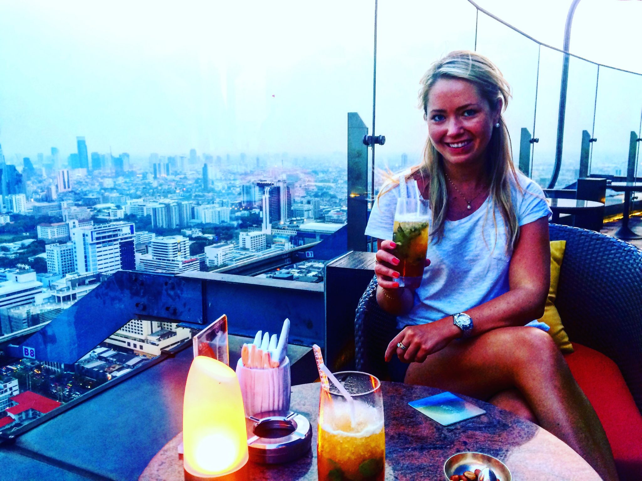 A picture of me having cocktails at the Red Sky rooftop bar