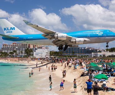 KLM flight landing over the beach