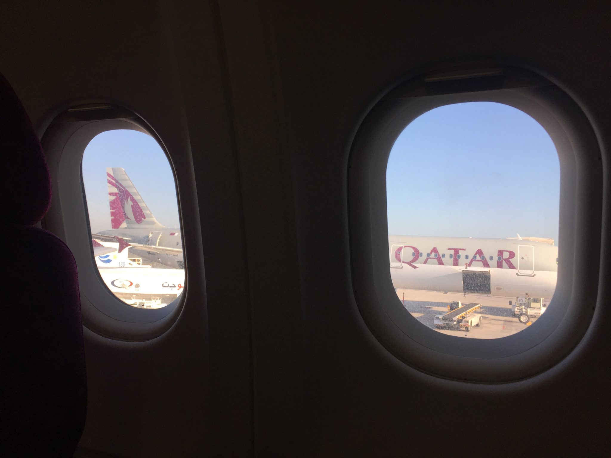 A picture of a Qatar airlines plane parked at Doha airport