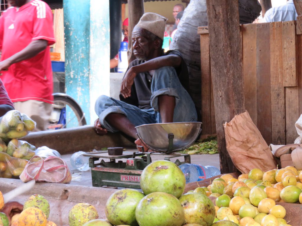a fruit seller in his stall