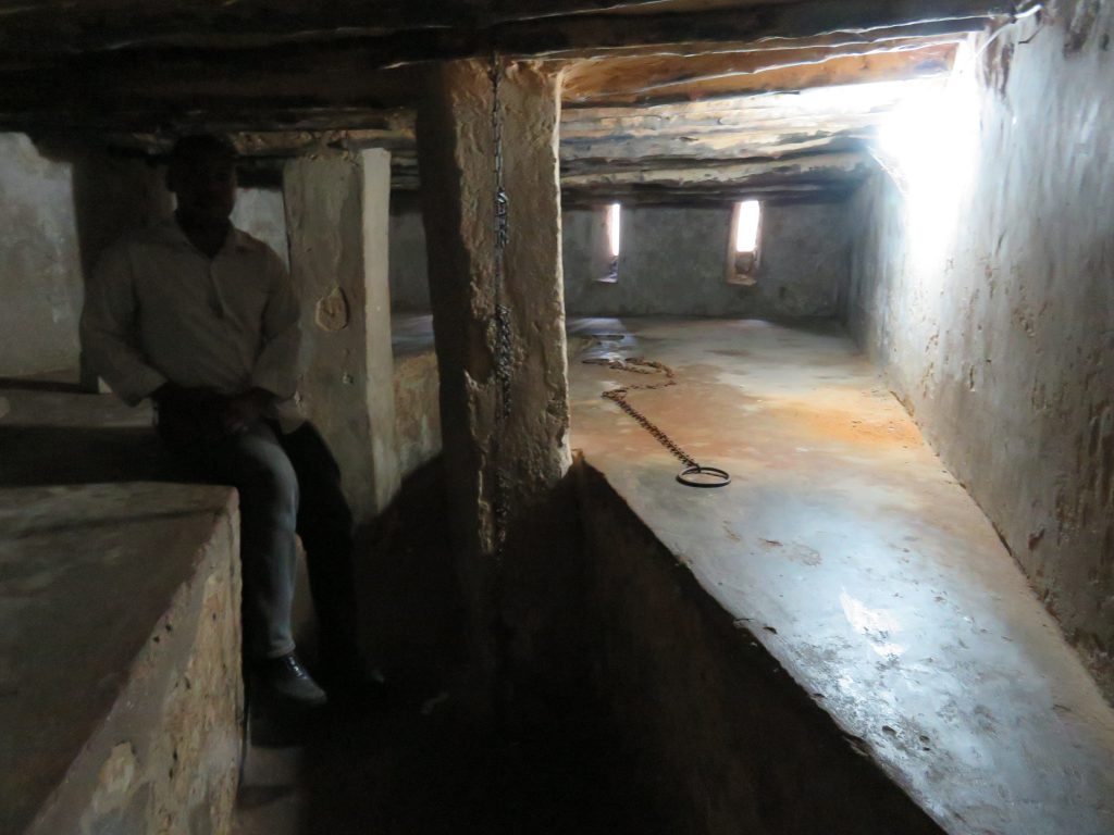 guide showing the chambers were they used to hold slaves