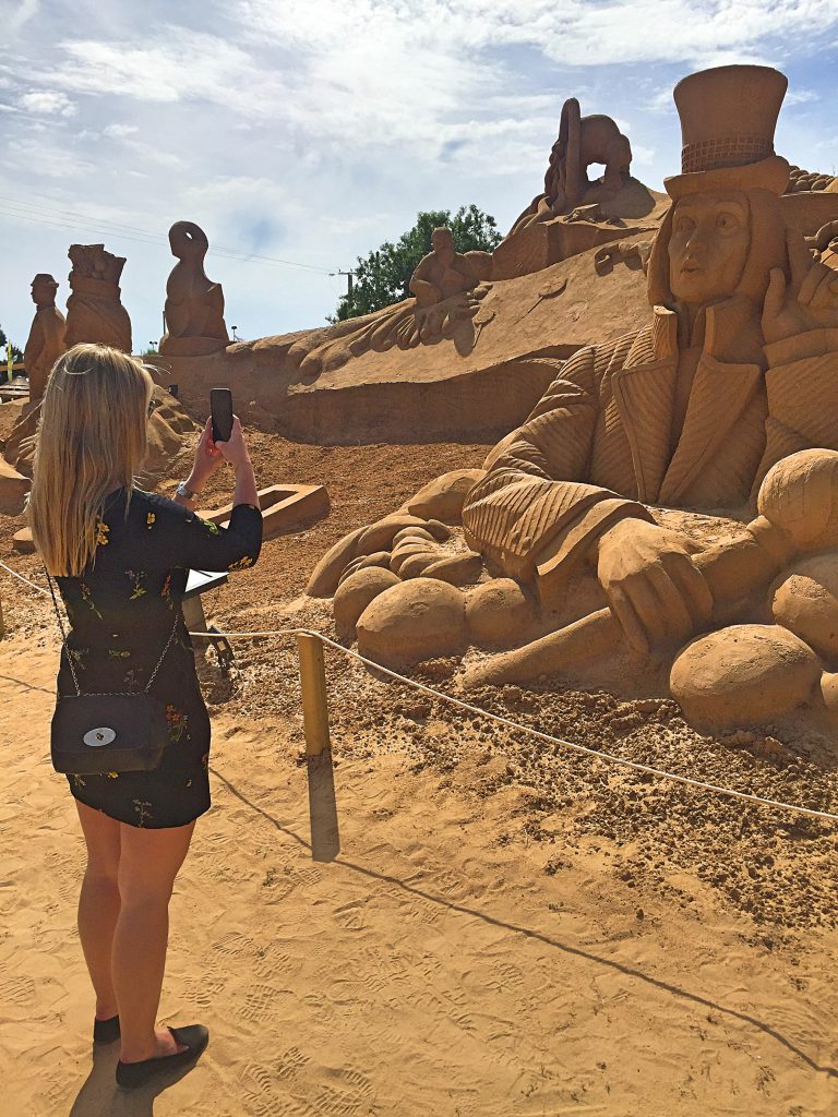 A picture of me taking pictures of mud sculptures