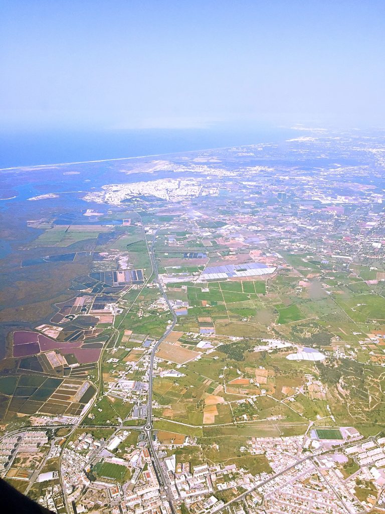 a view of the farms during takeoff 