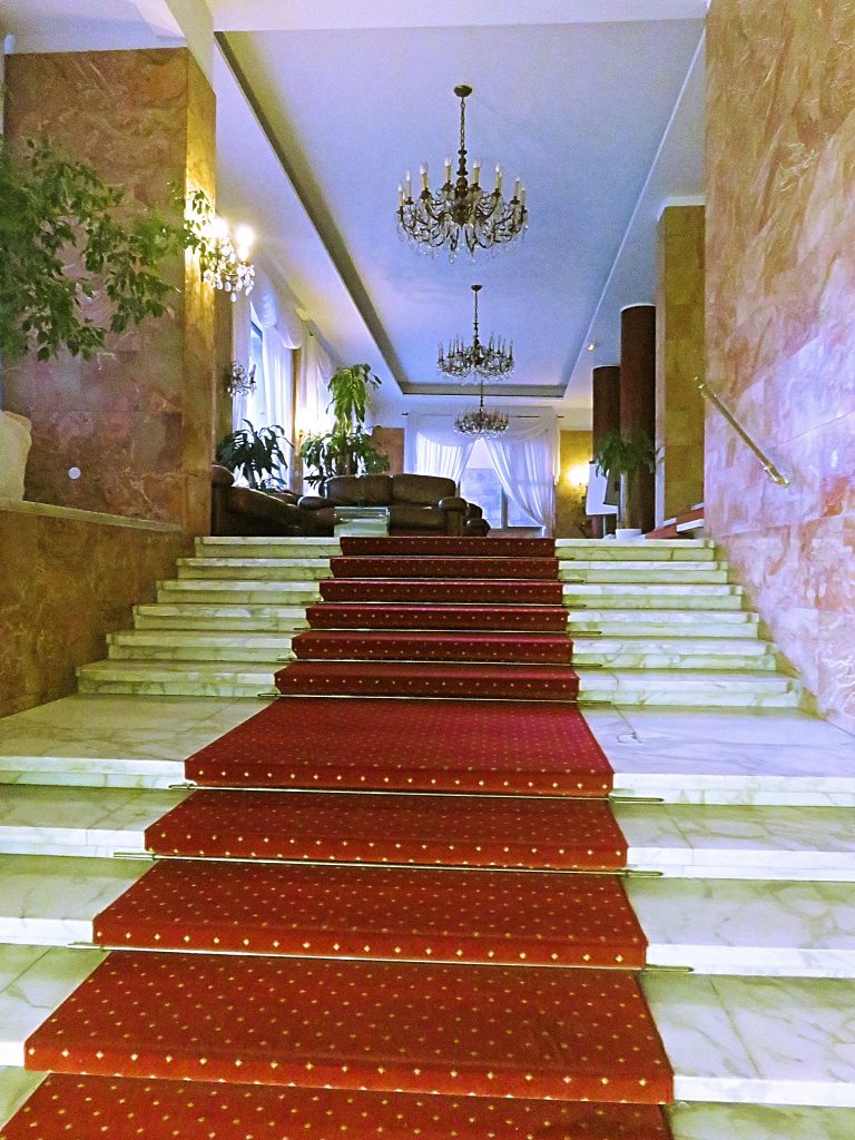 a picture of stairs and lobby at the hotel