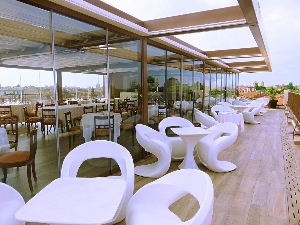 a picture of designer chairs in the rooftop restaurant