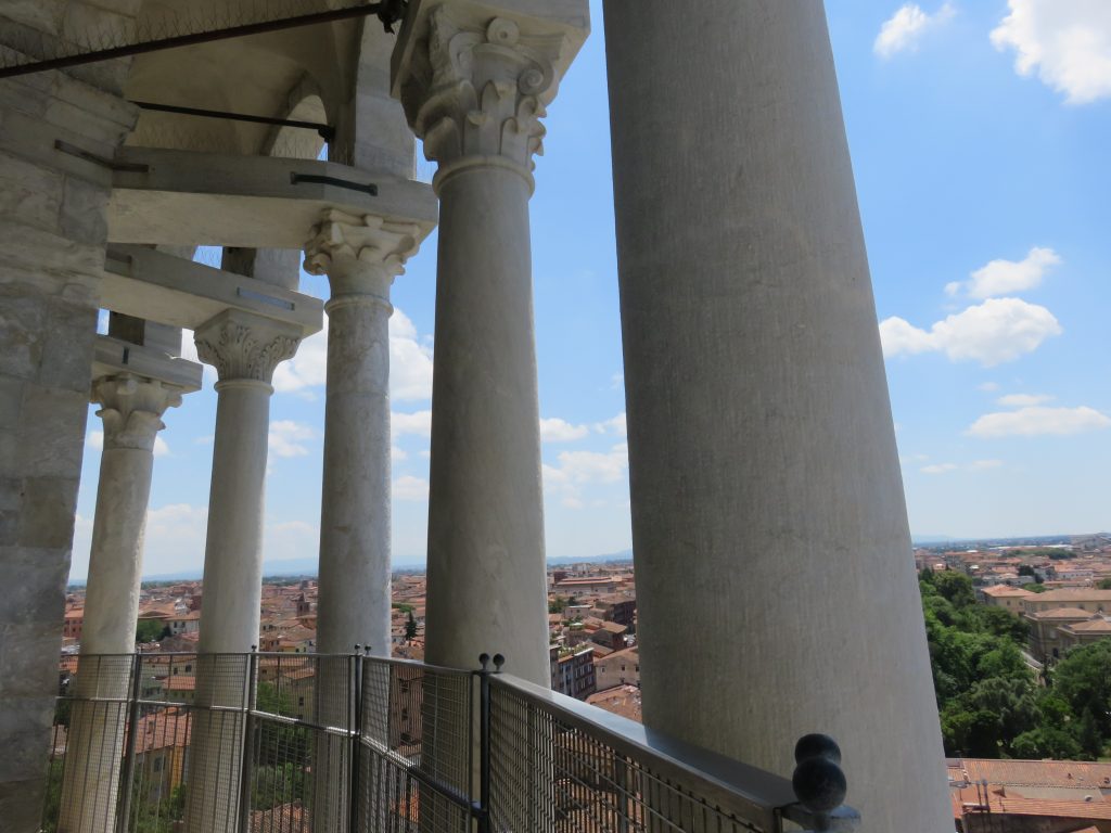 a picture of the pillars on the top floor of the tower