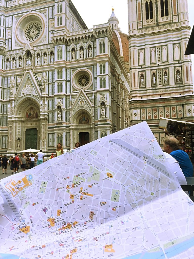 A picture of me holding a map outside the Cattedrale di S.Maria del Fiore