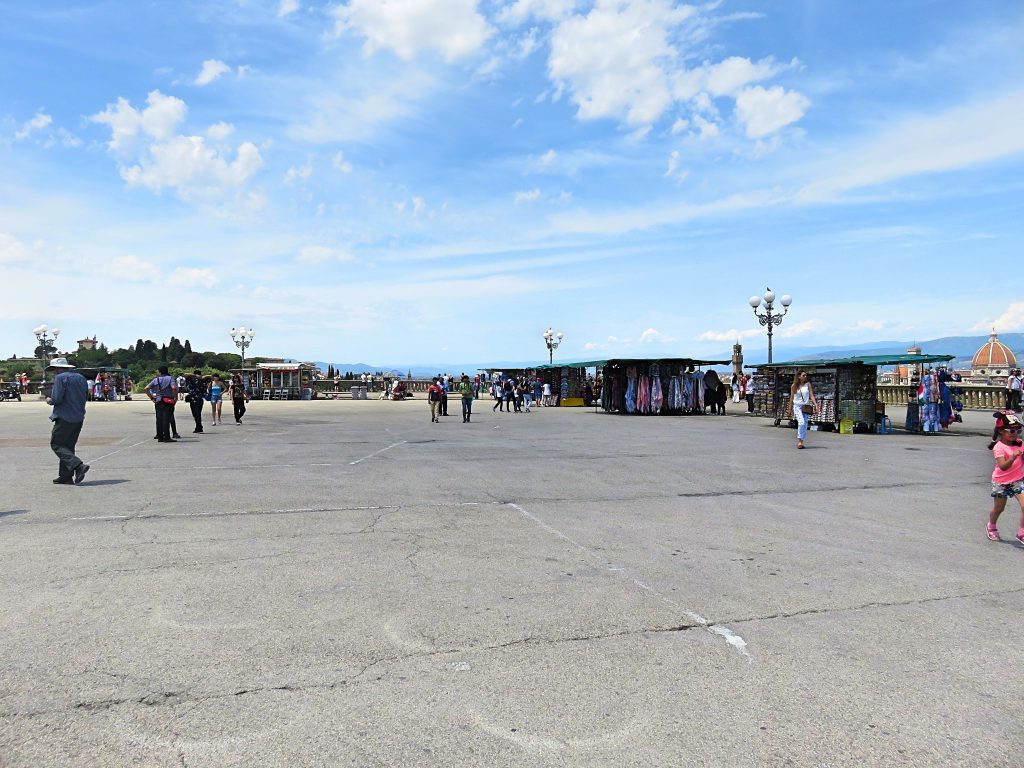 A picture of a square with souvenir stalls