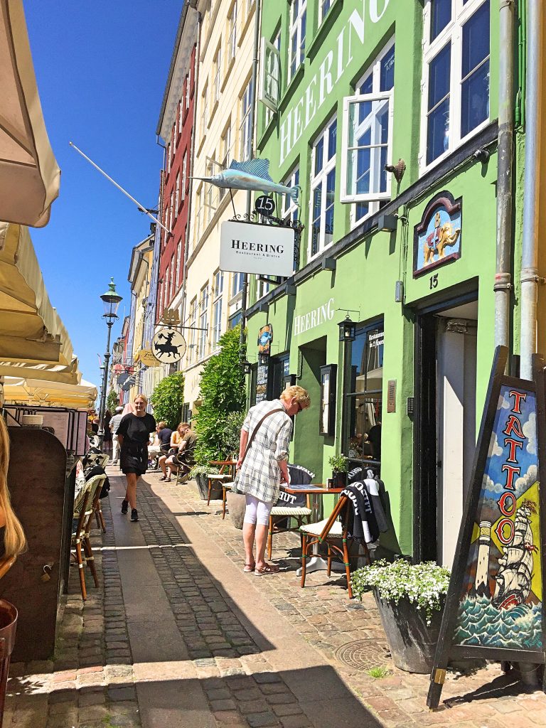 A picture of tourists walking on a charming street