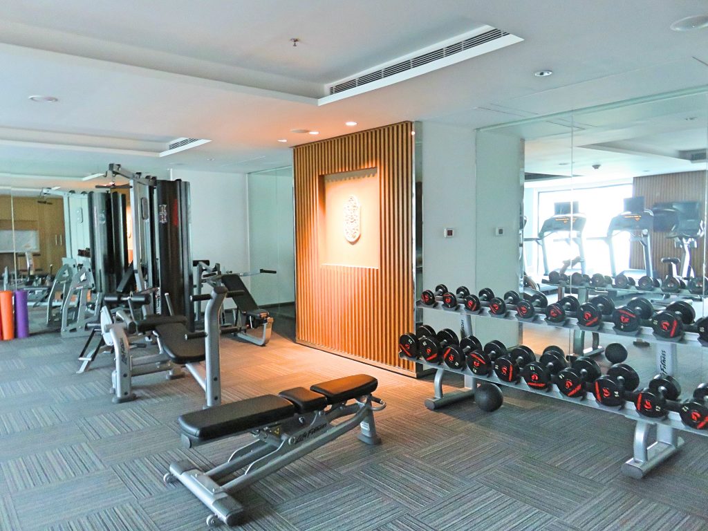 A picture of the gym with the weights and machines