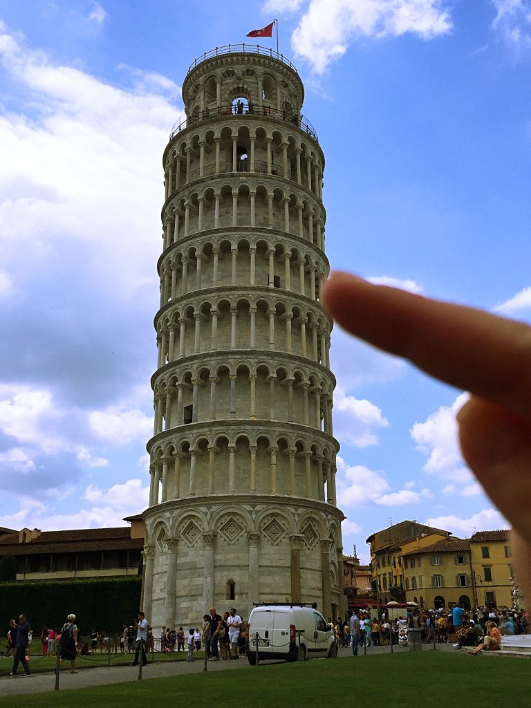 a picture of my finger pointing at the tower