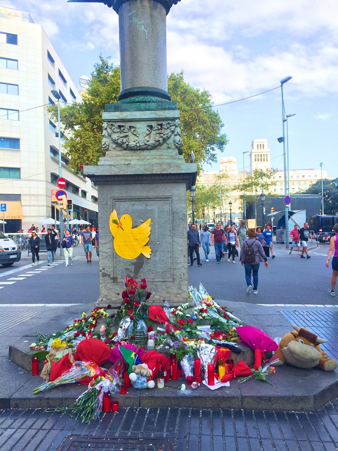 People leaving flowers at a memorial at La Ramblas Barcelona