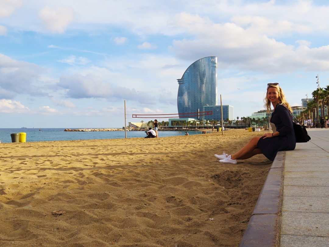 Me sitting on the beach with the W hotel in the back