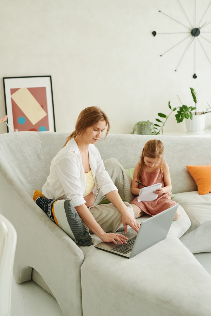 mother and child sitting on the couch