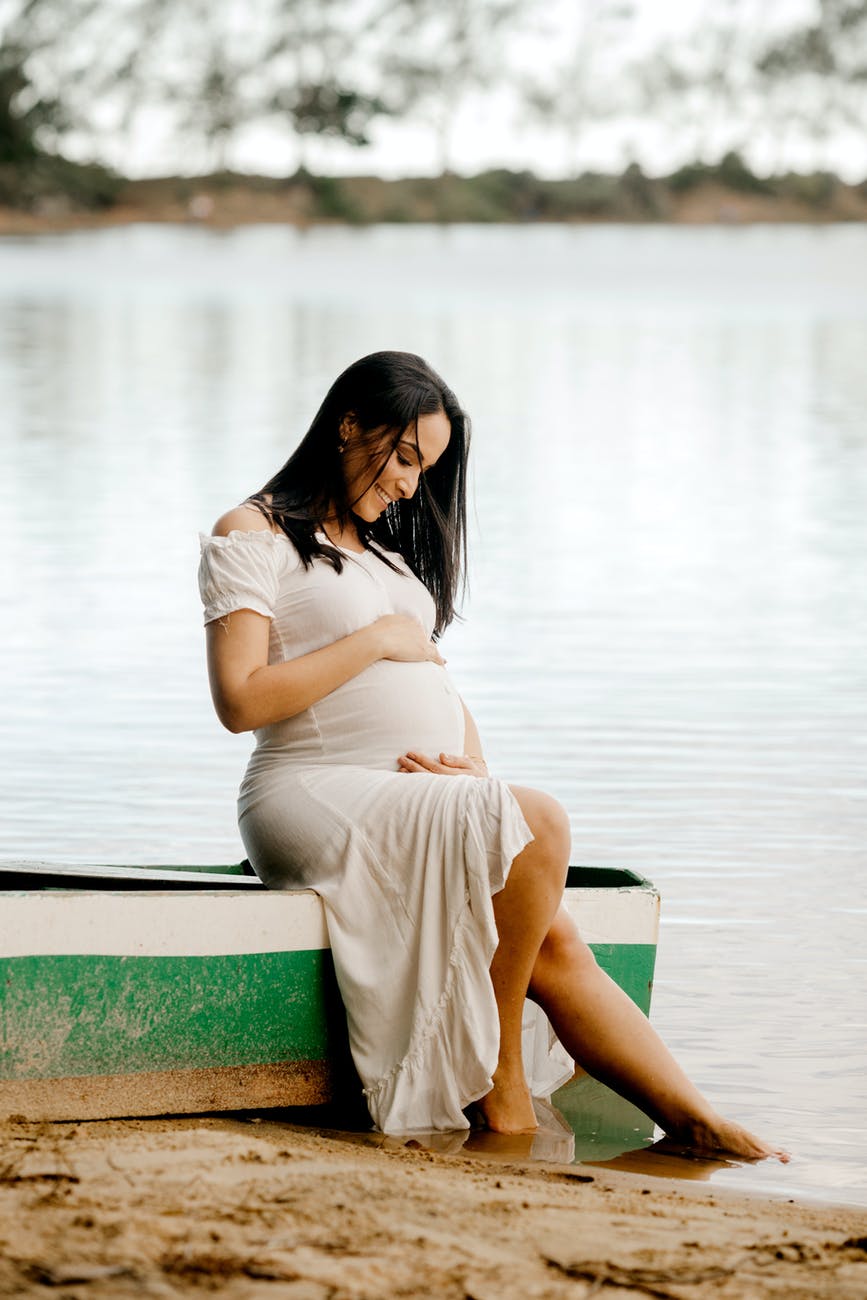 woman in white dress smiling