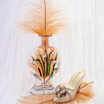 feathers in & around a vase 