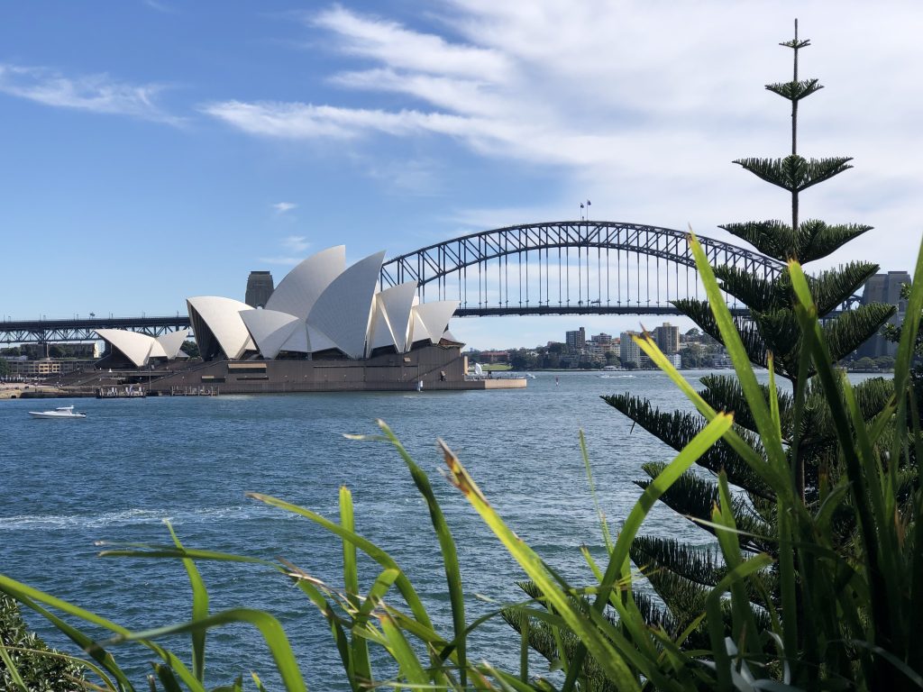 Sydney Harbor Bridge and Opera House seen across the water from scenic trail is why Sydney is the ultimate travel destination