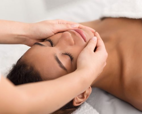 Spa face massage. Woman getting spa treatment