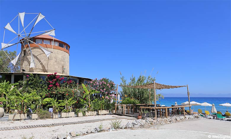 Restaurant and old mill by the beach in Ialyssos
