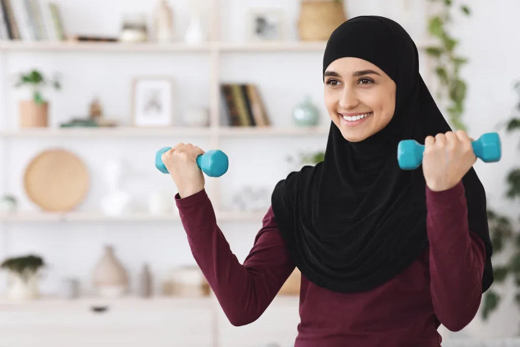 arabian woman lifting dumbells at home
