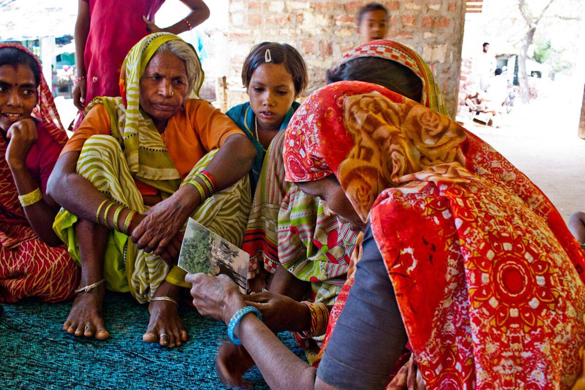 Local farmers in India, looking at a conversation starter card